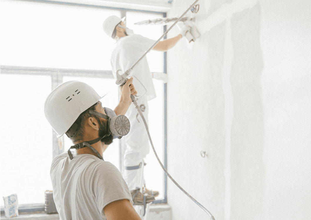 Schilders die aan het spuiten zijn